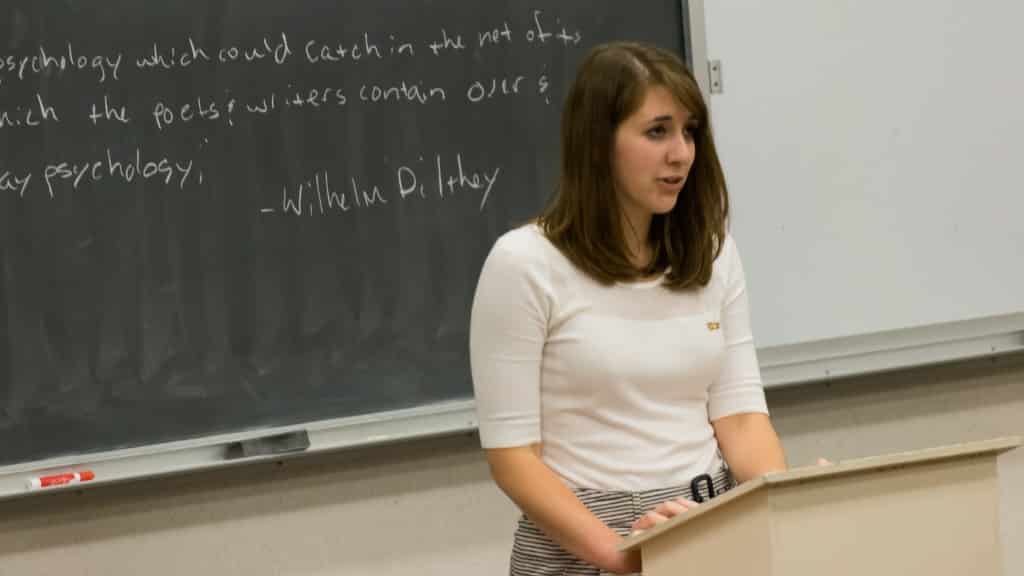 Antonia Busch giving a psychology presentation.